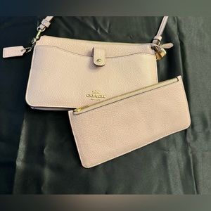Gently used soft pink Coach Crossbody with card holder.